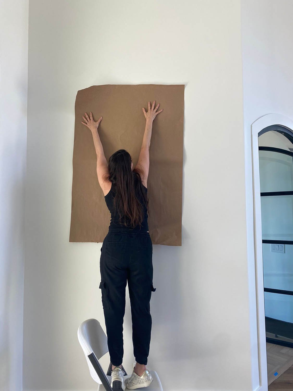 Eleven 11 Home Staging founder Vanessa Calderon at work during a staging installation