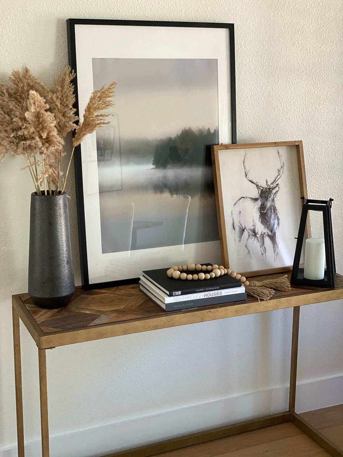 Soft staging decor: console table with art and dried botanicals by Eleven 11 Home Staging